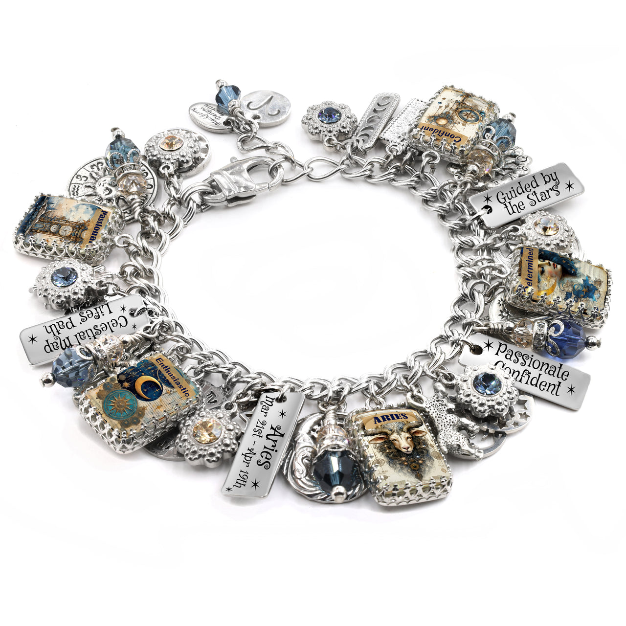 Handcrafted silver charm bracelet inspired by the Aries zodiac sign, featuring celestial-themed charms including a ram, moons, stars, and vintage-style Aries artwork under glass cabochons. Includes engraved zodiac date tags and sayings like ‘Passionate Confident’ and ‘Guided by the Stars’. Accented with blue and gold Austrian crystals. Displayed on a white background.