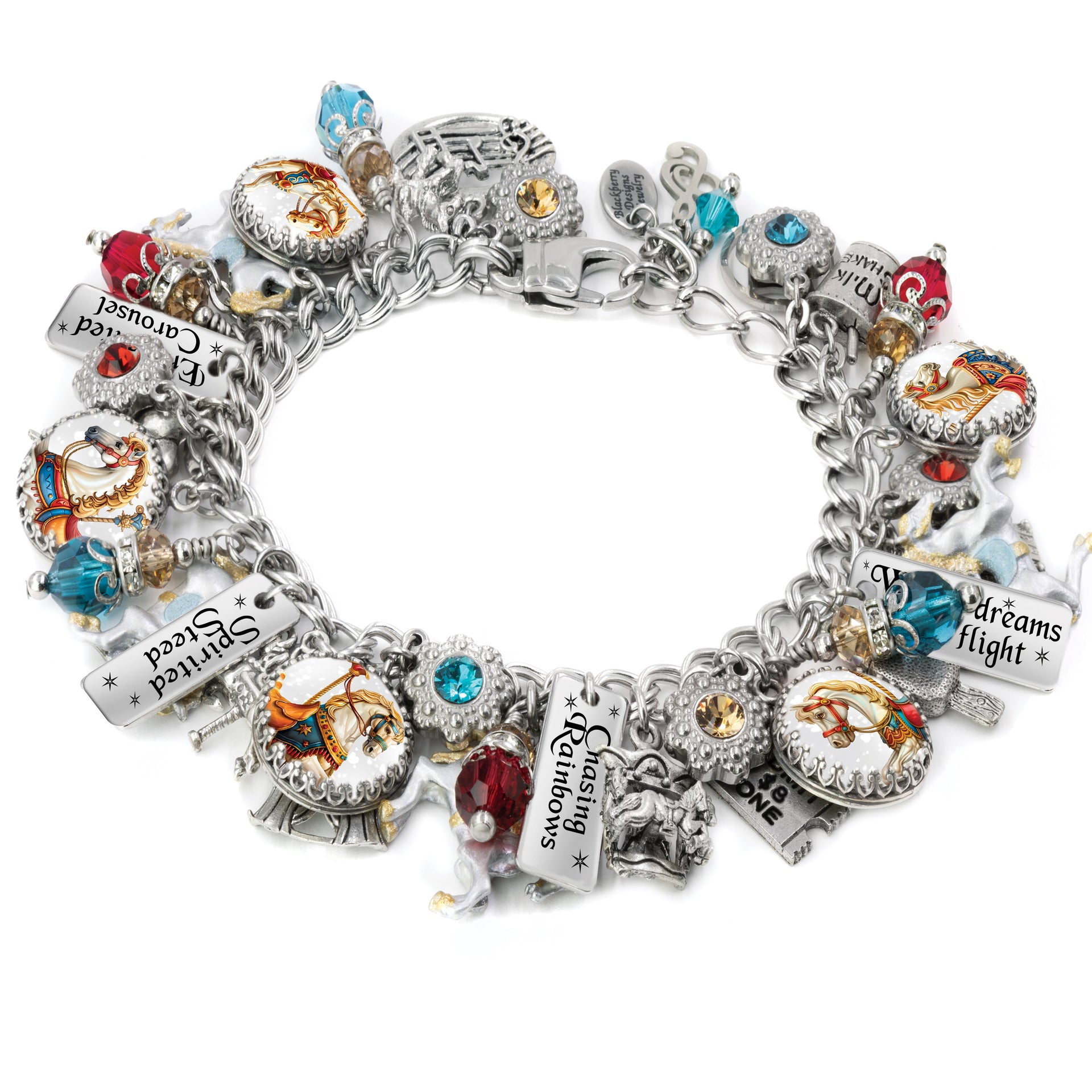 Silver carousel horse charm bracelet featuring colorful vintage carousel images, hand-set Austrian crystals, engraved tags like "Chasing Rainbows" and "Dreams Take Flight," and whimsical charms including unicorns, horses, and circus motifs, displayed on a white background.