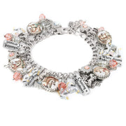 Silver charm bracelet featuring soft pastel carousel horse images, pink and peach Austrian crystals, engraved tags like “Chasing Rainbows” and “Where dreams take flight,” with hand-painted unicorn and horse charms, styled on a white background.