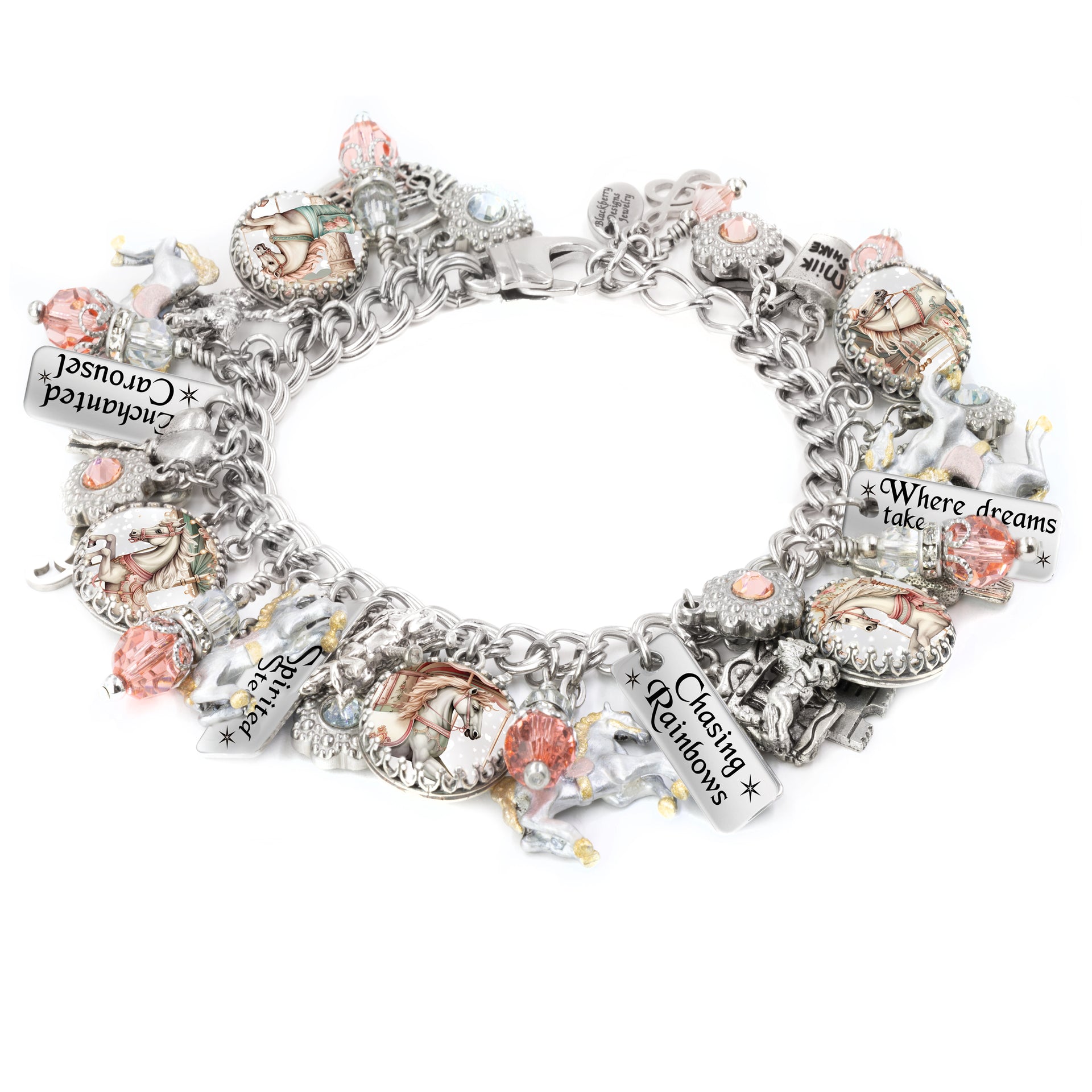 Silver charm bracelet featuring soft pastel carousel horse images, pink and peach Austrian crystals, engraved tags like “Chasing Rainbows” and “Where dreams take flight,” with hand-painted unicorn and horse charms, styled on a white background.