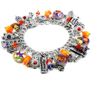 Halloween trick or treat bracelet with candy charms, pumpkins, and silver ghost accents