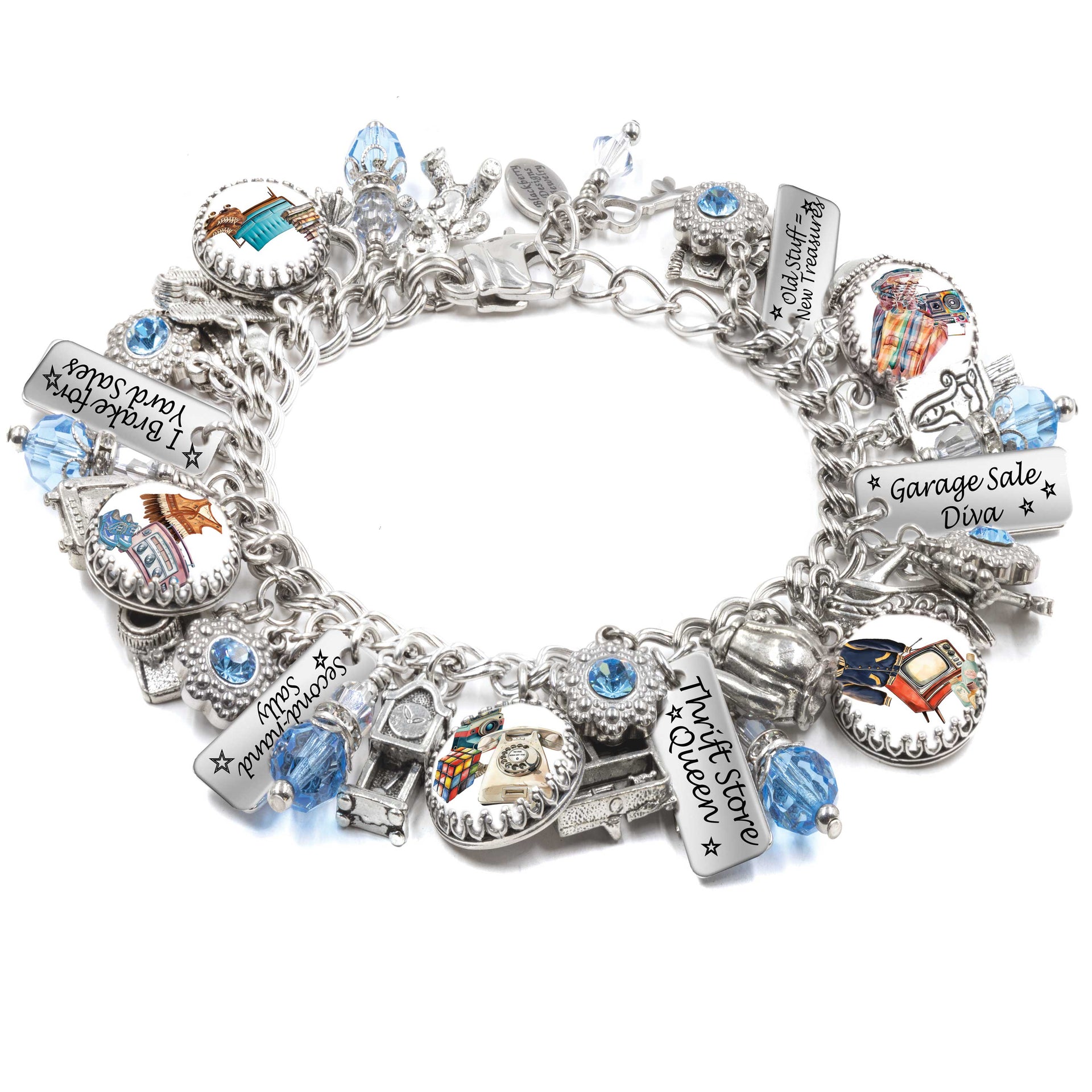 Handcrafted silver charm bracelet celebrating thrifting and treasure hunting, featuring artwork under glass cabochons of vintage finds, retro fashion, garage sales, and flea markets. Includes engraved tags with phrases like ‘Thrift Store Queen,’ ‘Garage Sale Diva,’ and ‘I Brake for Yard Sales.’ Accented with light blue Austrian crystals and detailed charms like old cash registers, cameras, and signs. Displayed on a white background.