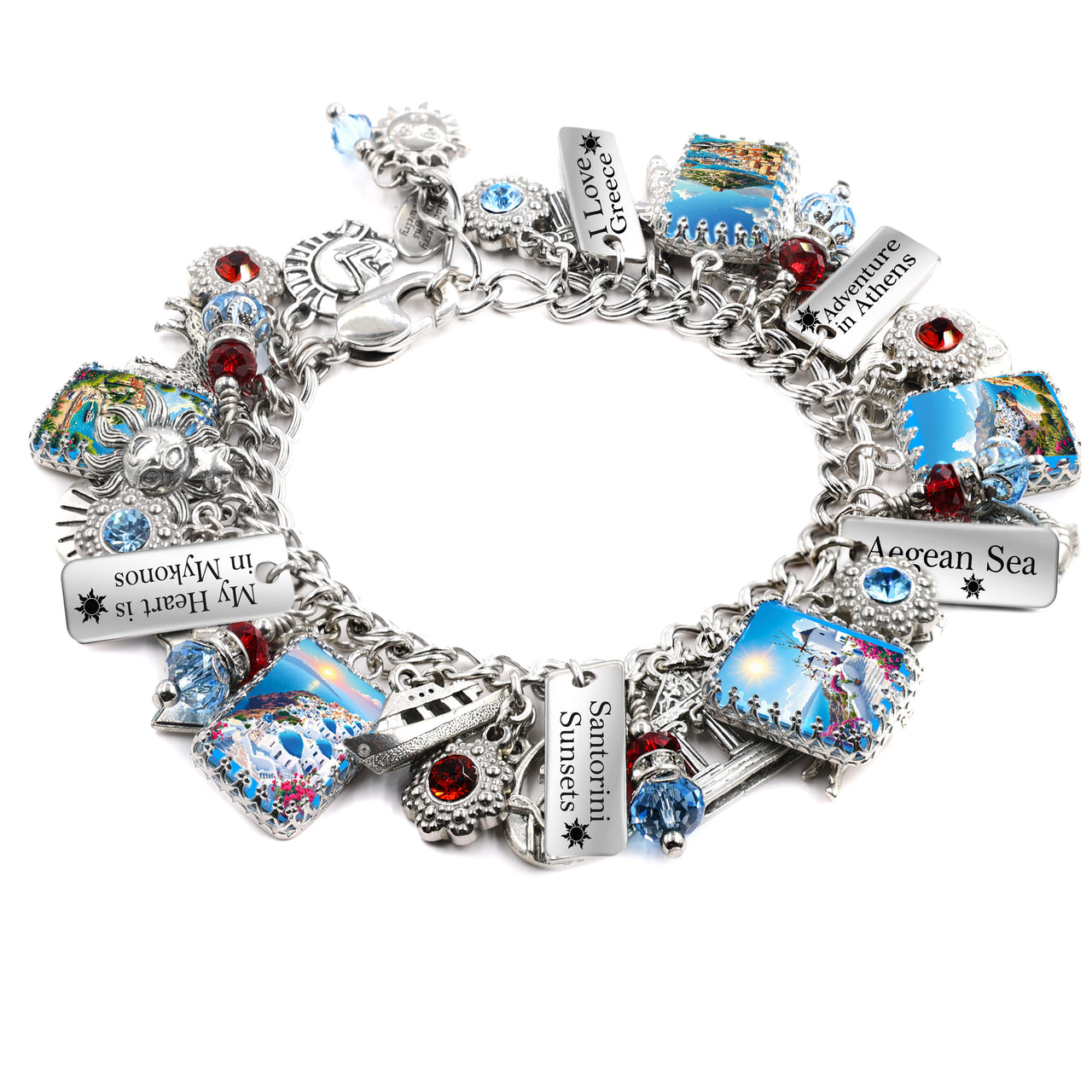 Handcrafted silver charm bracelet inspired by Greece, featuring scenic travel imagery under glass cabochons including Santorini sunsets, Athens landmarks, the Aegean Sea, and Mykonos. Includes engraved travel tags with sayings like ‘I Love Greece,’ ‘Adventure in Athens,’ and ‘My Heart is in Mykonos.’ Embellished with red and blue Austrian crystals, suns, sailboats, and Grecian symbols. Displayed on a white background.