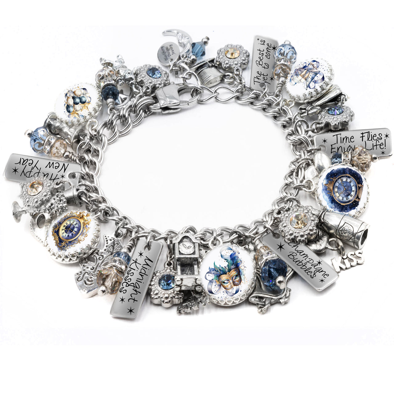 Silver New Year’s Eve charm bracelet featuring celebration-themed charms including champagne glasses, fireworks, clocks, and party hats. Includes glass cabochons with festive art, engraved tags like “Pop the Bubbly” and “Midnight Magic,” and is accented with gold and silver Austrian crystals. Displayed on a white background.