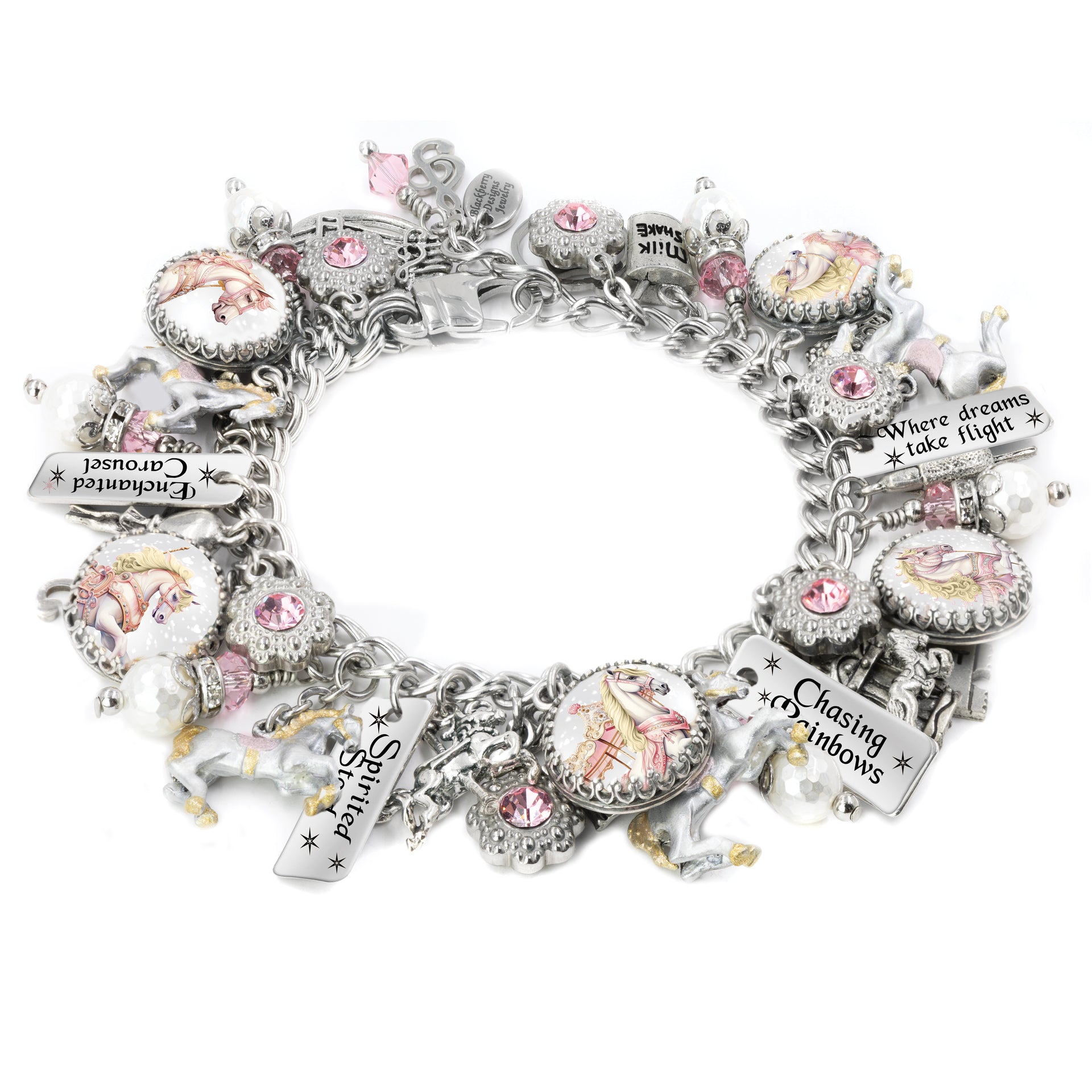 Silver charm bracelet featuring vintage-style pastel carousel horses, sparkling pink crystals, enamel horse charms, and engraved tags with whimsical sayings like âEnchanted Carouselâ and âChasing Rainbows,â displayed on a white background.