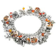 Handmade charm bracelet with nostalgic Halloween images and orange crystal accents