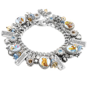 Silver charm bracelet inspired by Winnie the Pooh quotes, featuring classic book-style artwork under glass cabochons, engraved tags with beloved quotes like “You are braver than you believe” and “Forever & Always,” accented with gold and red Austrian crystals, and charms including honey pots, bees, and woodland leaves. Displayed on a white background.