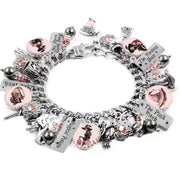 Retro Halloween charm bracelet in pink and black with 1940s-style witch images, 14 silver Halloween charms, and sparkling rose pink crystals.