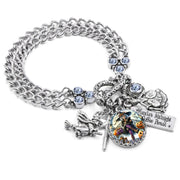 Halloween charm bracelet featuring a colorful retro witch in pink and black, surrounded by pumpkins, coffee cup, silver charms, and icy blue crystals.