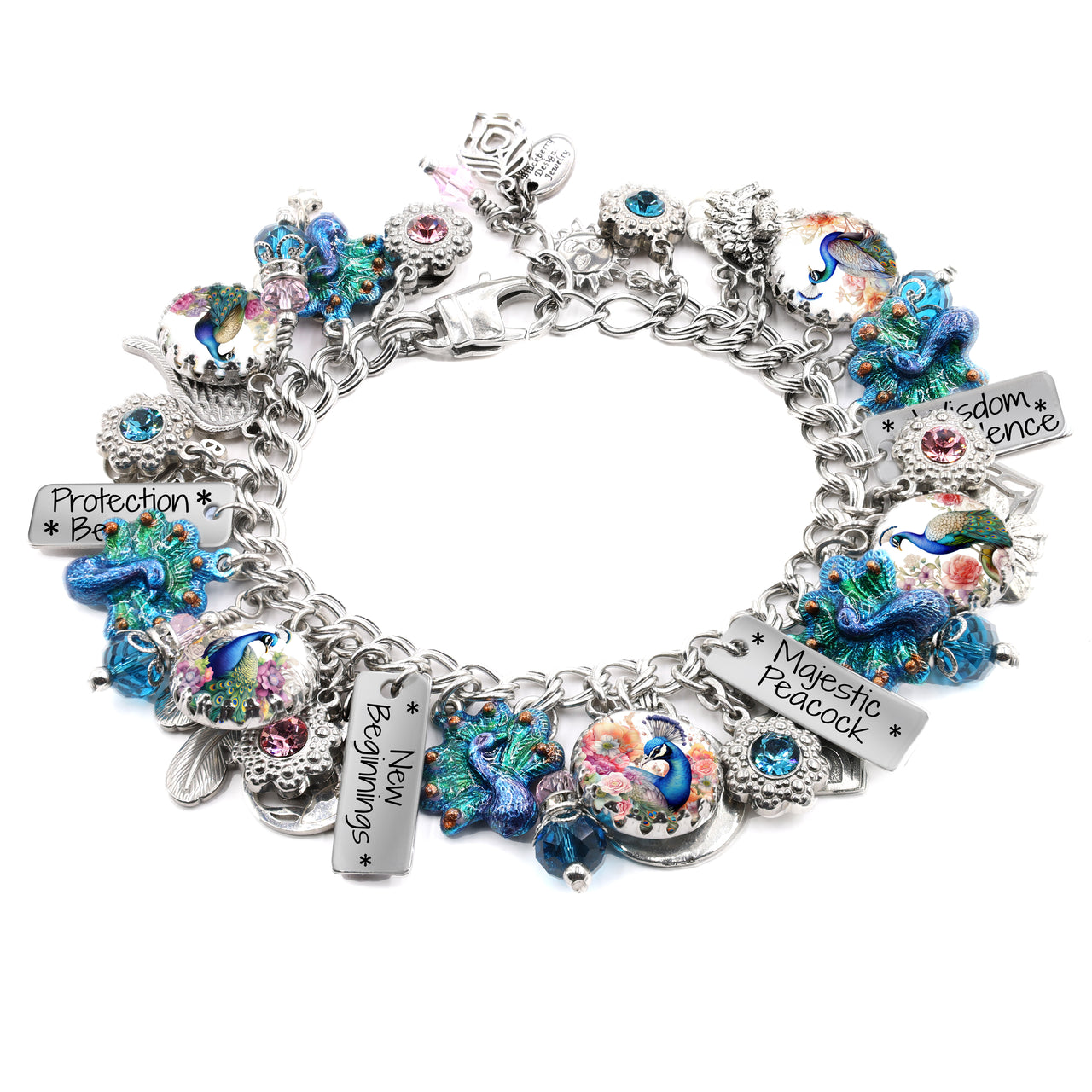 Handcrafted silver charm bracelet featuring vibrant peacock-themed charms, including colorful enamel peacocks, floral artwork under glass cabochons, and engraved tags with inspirational sayings like ‘Majestic Peacock,’ ‘New Beginnings,’ and ‘Wisdom & Patience.’ Embellished with blue, teal, and pink Austrian crystals and detailed bird accents. Displayed on a white background.