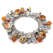 silver charm bracelet for autumn with crystal pumpkins and pumpkin spice sayings, engraved charms, vintage images, and lots of autumn orange crystals and loaded with silver charms of everything pumpkin spice.