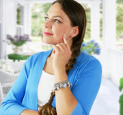 woman in blue wearing china bracelet