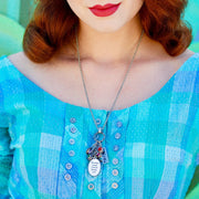 closeup of woman wearing grandmother birthstone necklace