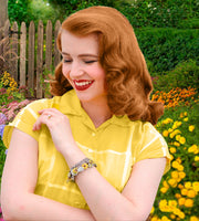 woman wearing sunflower jewelry - charm bracelet