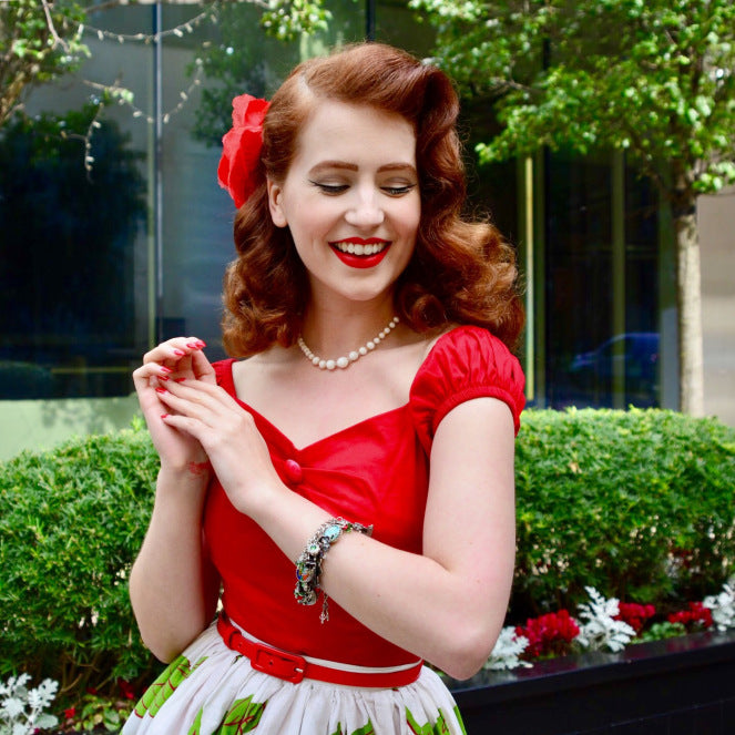 woman wearing Wizard of Oz charm bracelet