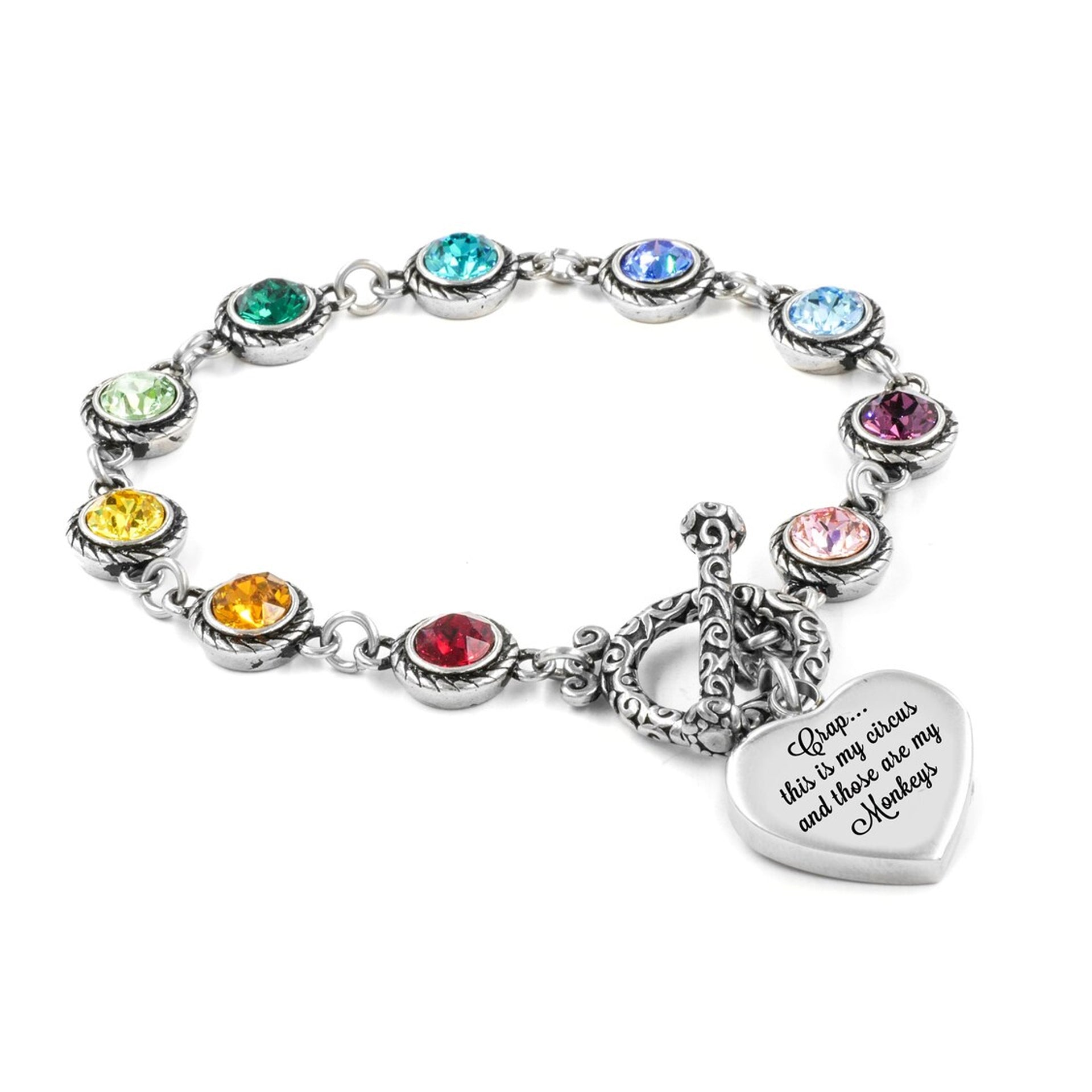 A silver bracelet with a heart-shaped charm attached, featuring a variety of colorful gemstones.