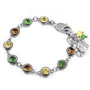 A bracelet with a silver clasp and various colored gemstones, including yellow, green, and orange stones. The bracelet is also adorned with a charm that has a flower design.