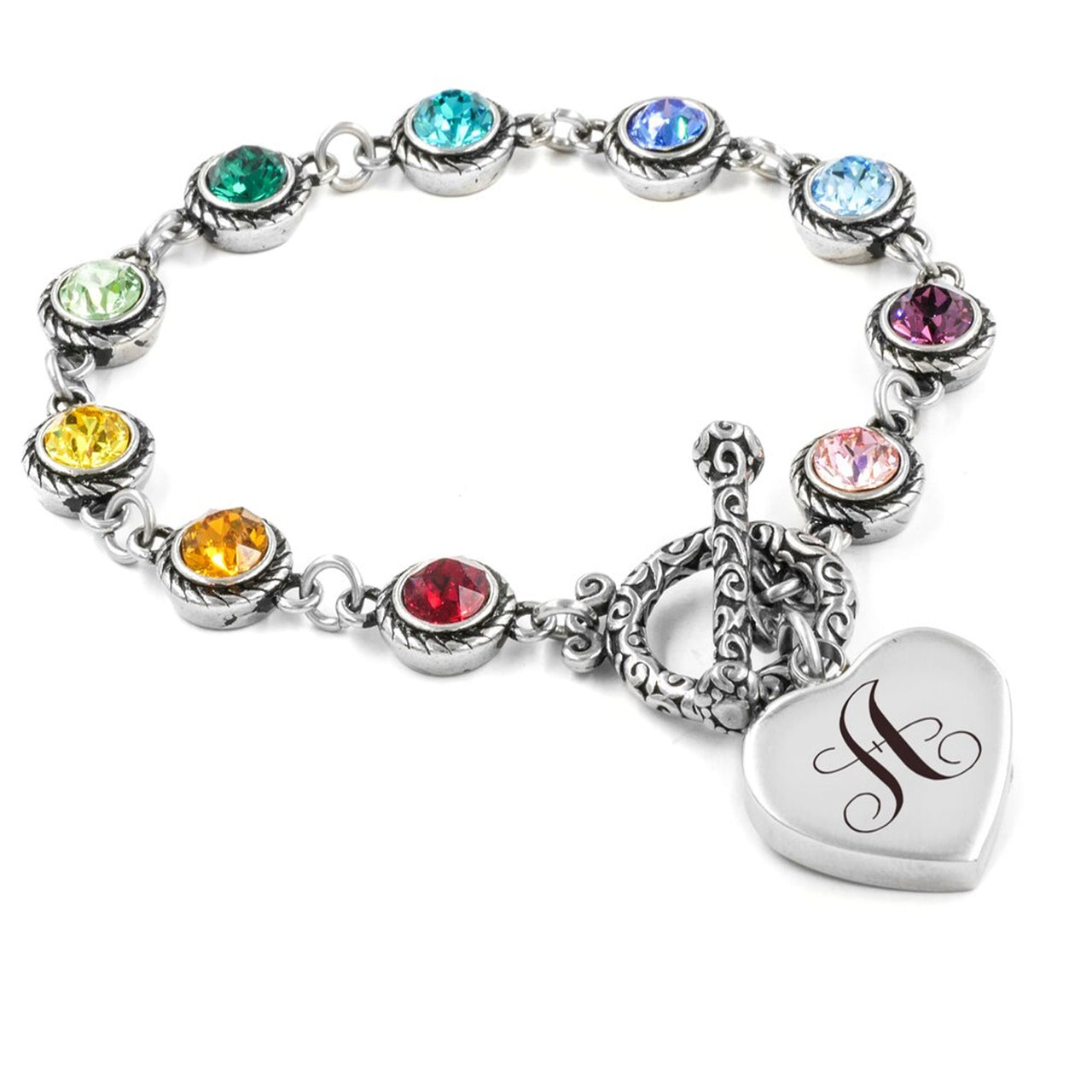A silver bracelet adorned with colorful gemstones and a heart-shaped charm featuring a monogrammed initial.