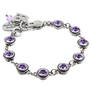 A silver-toned bracelet adorned with purple gemstones, featuring a charm and a clasp.