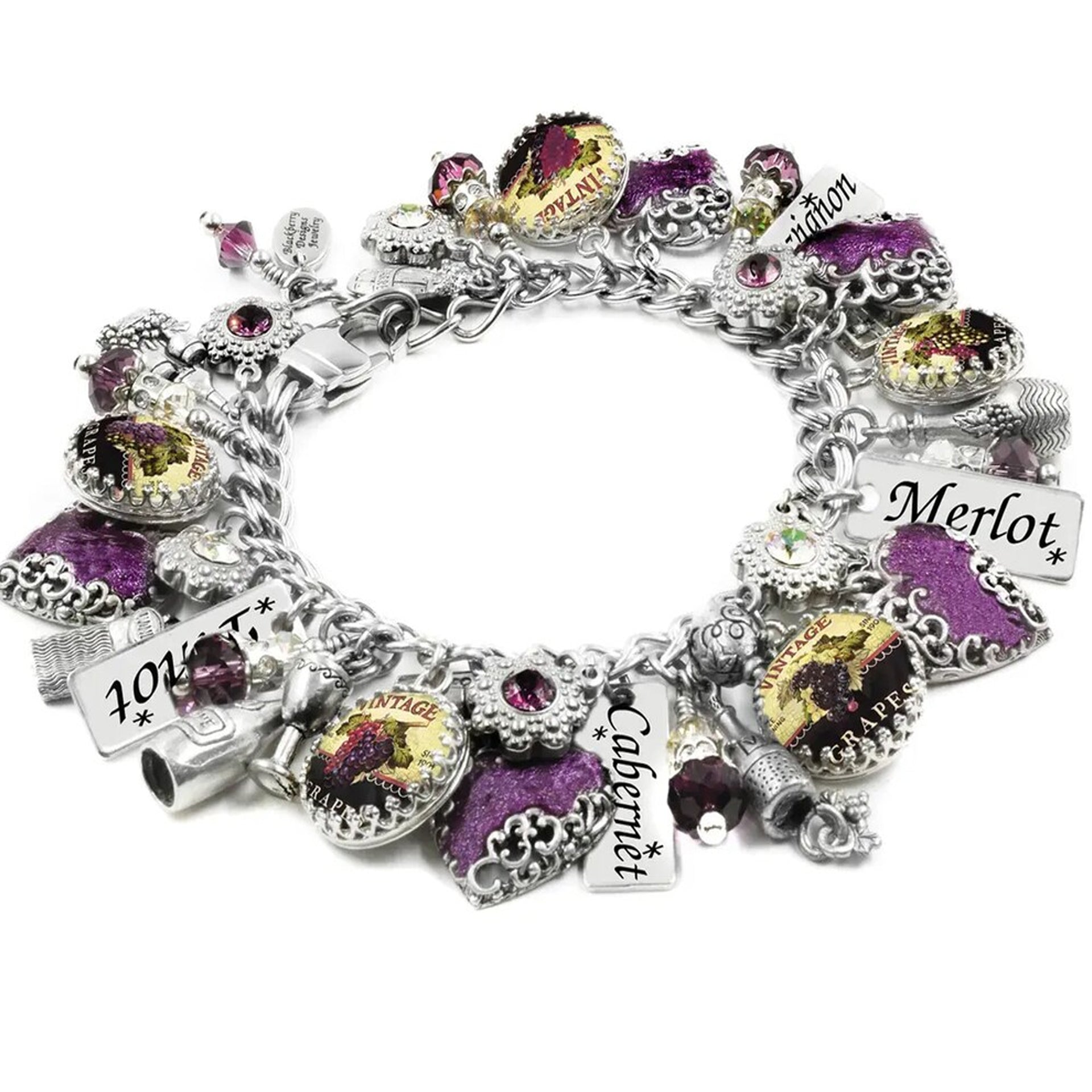 A bracelet adorned with various charms, including a grape, a wine glass, and other decorative elements, as well as charms with the words "Merlot" and "Cabernet".