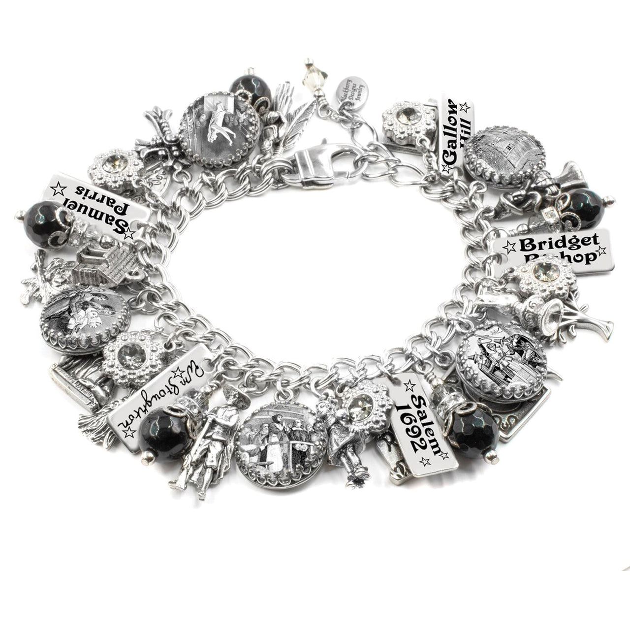 A silver and black charm bracelet with various charms and pendants attached to it.