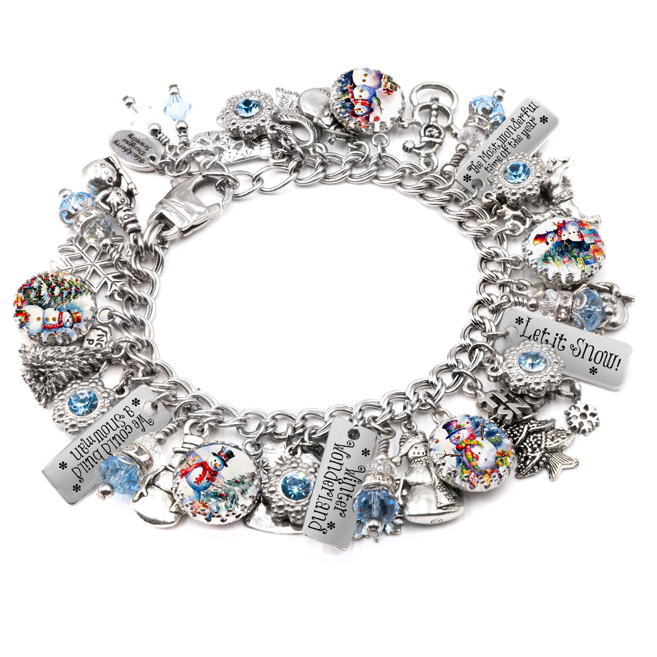 A silver-colored charm bracelet adorned with various charms, including snowmen, bells, and other festive ornaments. The bracelet is decorated with small blue and silver beads, and the charms are arranged in a circular pattern.