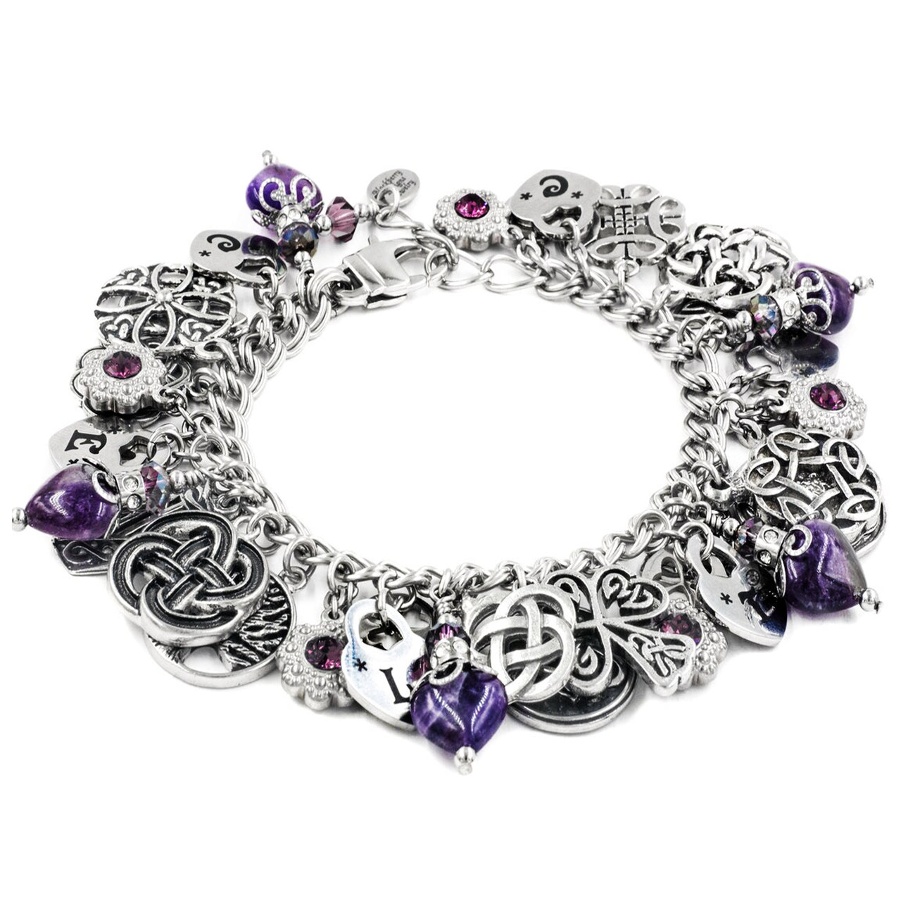 A silver-toned charm bracelet adorned with various charms, including purple gemstones, hearts, and intricate designs.
