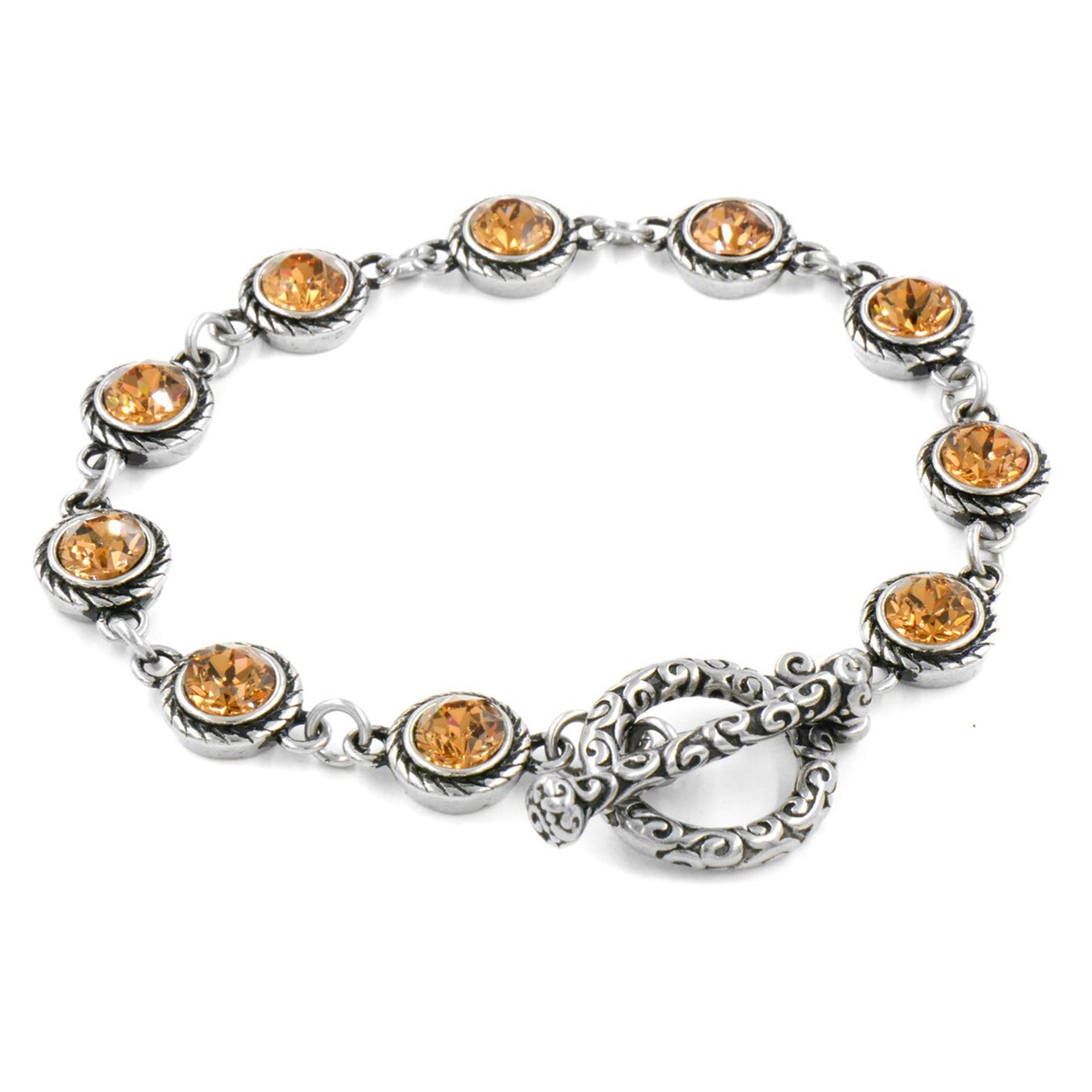 A silver bracelet with a clasp and a row of small, round, yellow gemstones or stones attached to it.