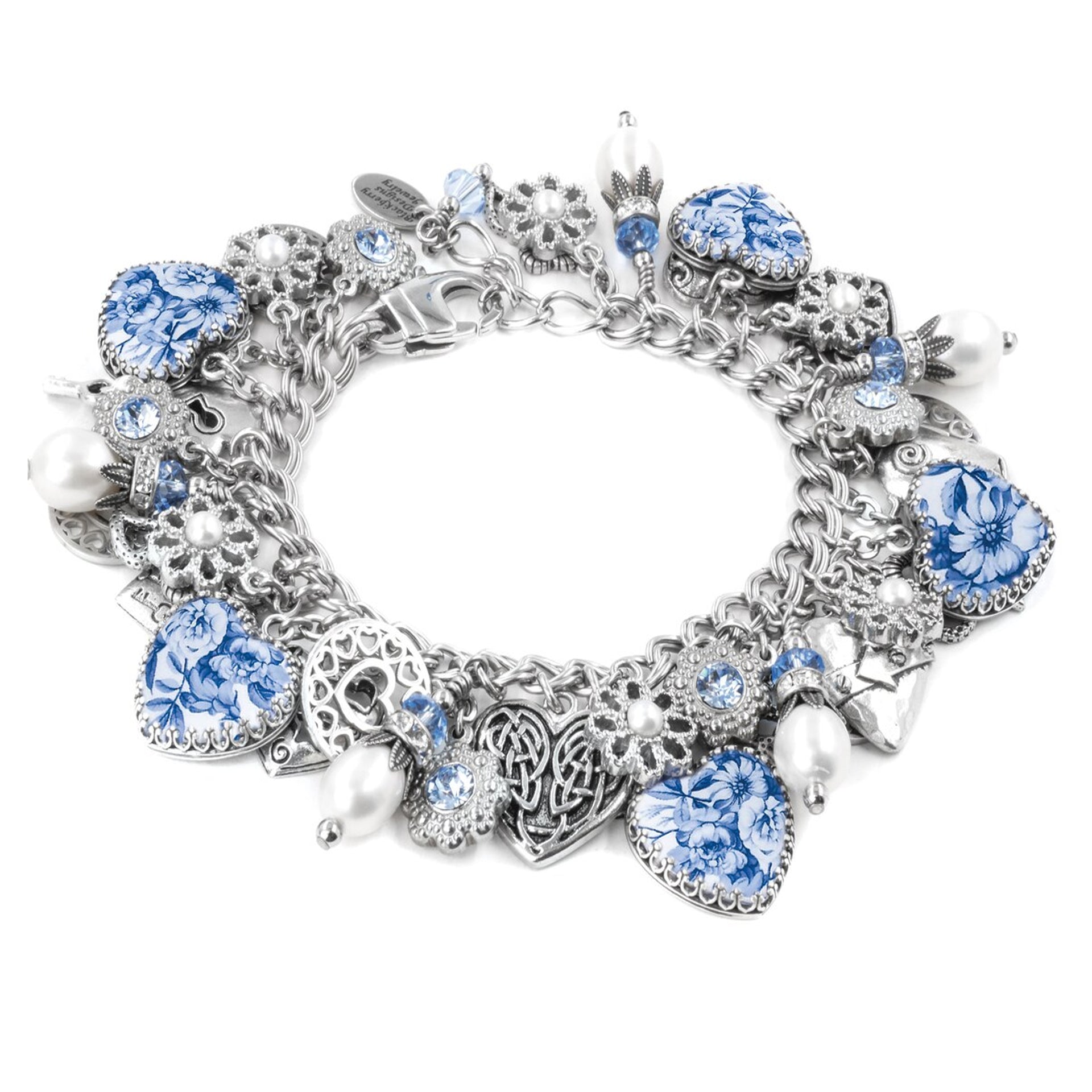 A silver and blue charm bracelet with various charms, including hearts, flowers, and pearls, as well as a clasp and clasping mechanism.