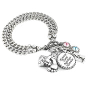 A silver-colored bracelet with various charms and charms attached to it.