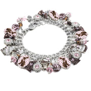 A bracelet with various charms and beads in shades of pink and silver.