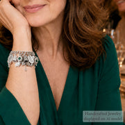 Woman in a green dress with jewelry at a festive gathering