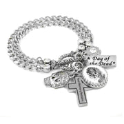 Silver charm bracelet with sugar skulls and hearts and katrina