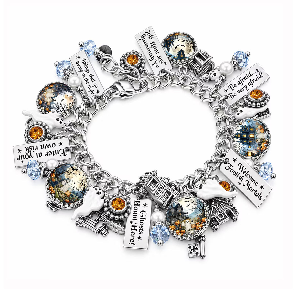 A silver charm bracelet featuring various Halloween-themed charms, including ghosts, haunted houses, keys, and text plaques, with clear and orange gemstones, displayed on a white background.