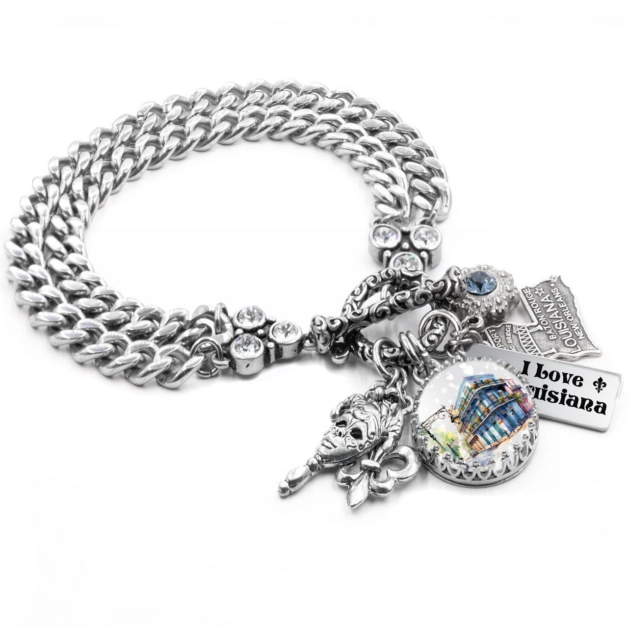 Silver charm bracelet inspired by Louisiana, featuring fleur-de-lis charms, Mardi Gras mask, French Quarter scenes, and state symbols, accented with blue and gold Austrian crystals and engraved tags like “Bayou State” and “Cajun Queen.”