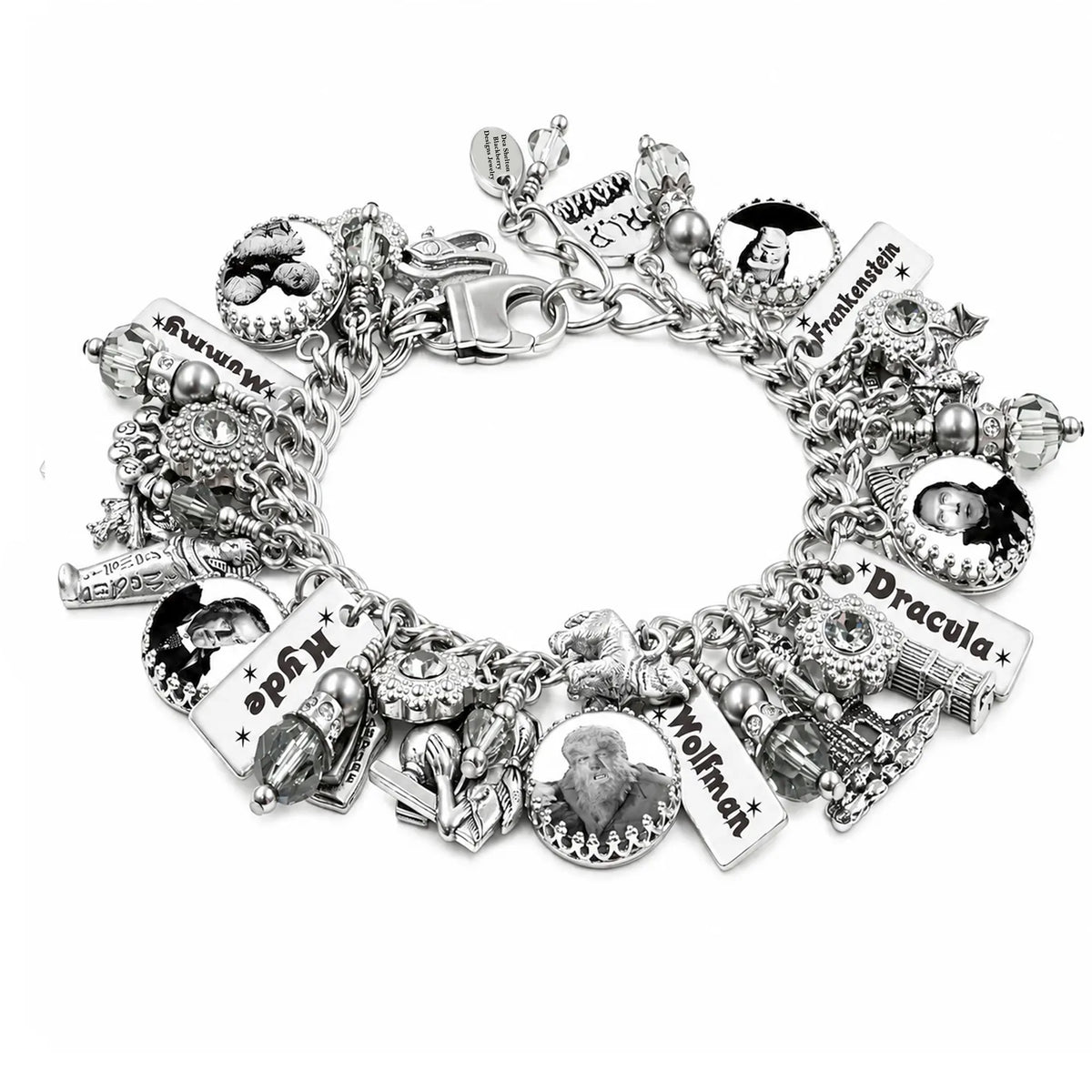 A silver charm bracelet featuring multiple themed charms, including names and portraits of fictional characters from Dracula, displayed on a clean white background.
