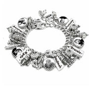 A silver charm bracelet featuring multiple themed charms, including names and portraits of fictional characters from Dracula, displayed on a clean white background.