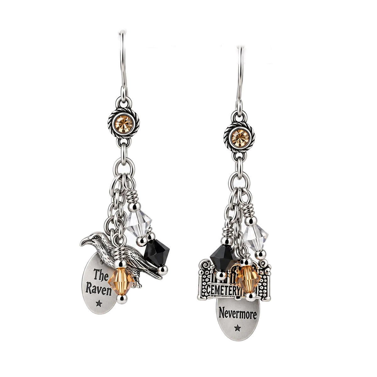 A pair of gothic-style dangle earrings featuring silver-toned metal charms, including a raven, a tombstone engraved with 'The Raven' and 'Nevermore', clear faceted beads, and small black and amber crystal accents, shown against a plain white background.
