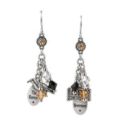 A pair of gothic-style dangle earrings featuring silver-toned metal charms, including a raven, a tombstone engraved with 'The Raven' and 'Nevermore', clear faceted beads, and small black and amber crystal accents, shown against a plain white background.