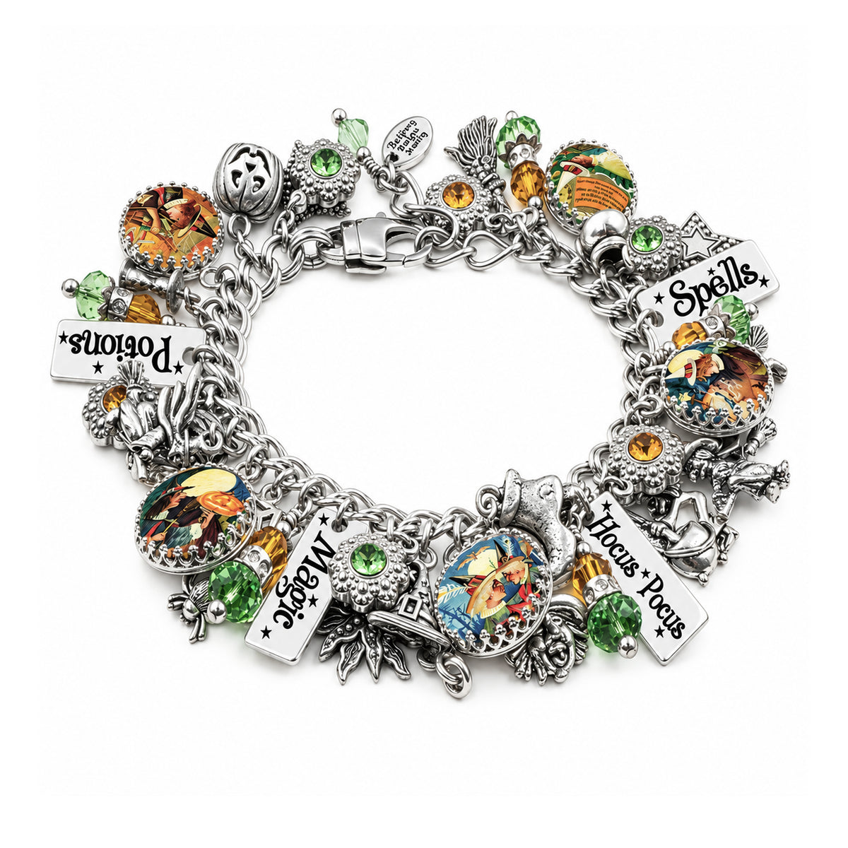 A silver charm bracelet featuring Halloween-themed charms, including a skull, potion bottle, cauldron, broom, spider, and text charms reading 'Potions', 'Spells', 'Magic', and 'Horns of Power', embellished with colorful enamel and green and orange gemstones on a white background.