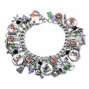 Rainbow witch charm bracelet with 1960s-style witches in colorful costumes, orange and amethyst crystals, and engraved silver star charms.