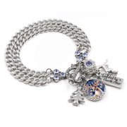 Silver reindeer charm bracelet with sleigh, pine tree, and “Guided by the North Star” tag, blue crystal accent, on tarnish-free stainless chain.