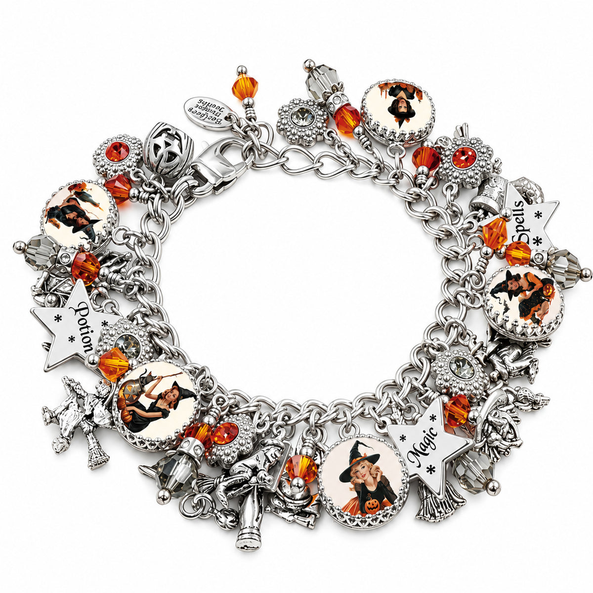 Retro Halloween charm bracelet with orange crystals, vintage pin-up witches in orange and black outfits, and silver engraved star charms.