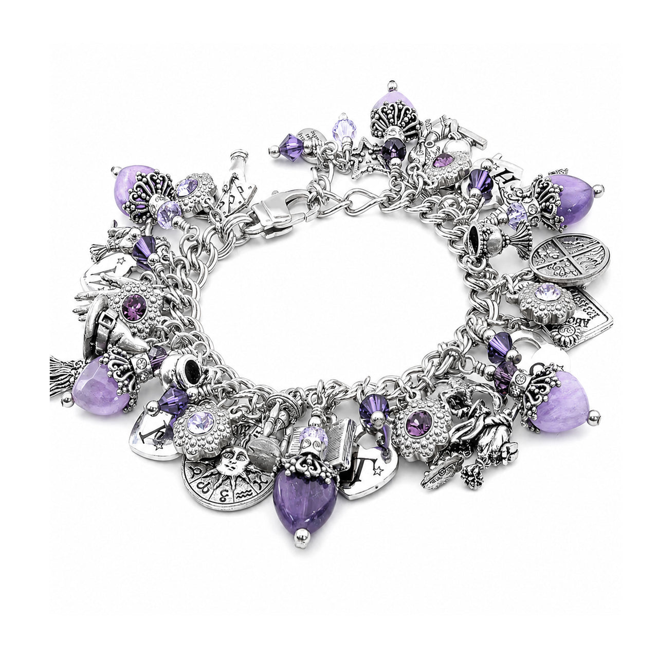 A silver charm bracelet featuring various gothic and occult-themed charms, including a skull, crossbones, pentacle, and key, embellished with purple faceted gemstones, set against a plain white background.