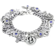 A silver-toned charm bracelet adorned with various charms, including a star, a moon, and a zodiac symbol, as well as a charm that says "Pisces". The bracelet also features a charm that says "Water" and another that says "Love Dream Balance". The bracelet is embellished with blue gemstones, adding a touch of color to the overall design.