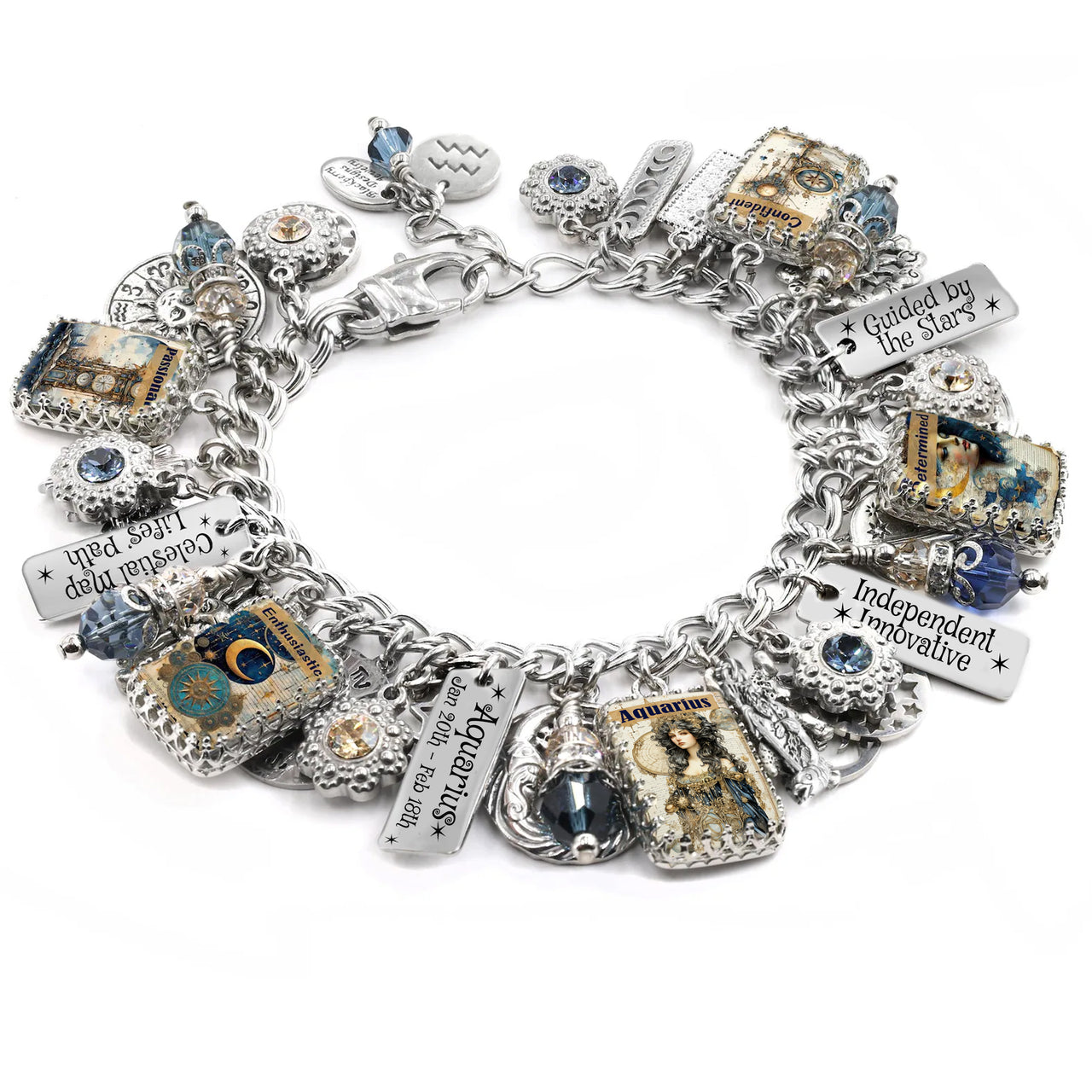 Handcrafted silver charm bracelet inspired by the Aquarius zodiac sign, featuring celestial and astrology-themed charms including stars, moons, and vintage-style Aquarius artwork under glass cabochons. Includes engraved charms with zodiac dates and phrases like ‘Independent Innovative’ and ‘Guided by the Stars’. Embellished with blue and gold Austrian crystals. Displayed on a white background.
