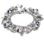 A silver-toned charm bracelet adorned with various charms, including a heart-shaped charm, a quilting charm, and other decorative elements.