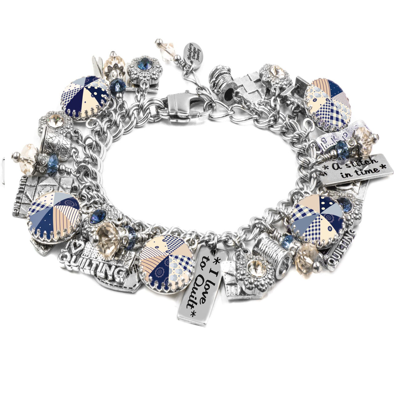 A silver-toned charm bracelet adorned with various charms, including a heart-shaped charm, a quilting charm, and other decorative elements.