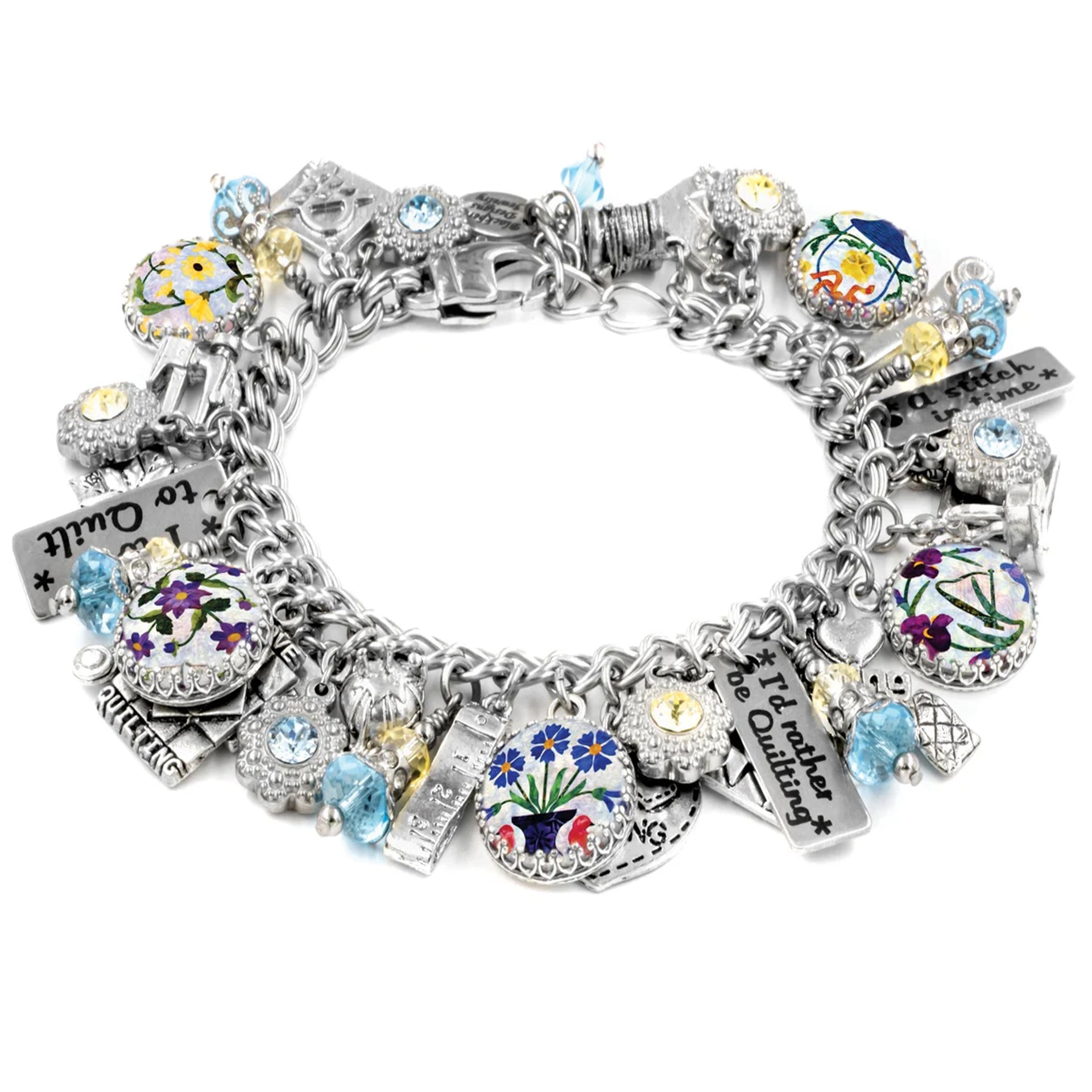 A silver-toned charm bracelet adorned with various charms, including flowers, gemstones, and other decorative elements.