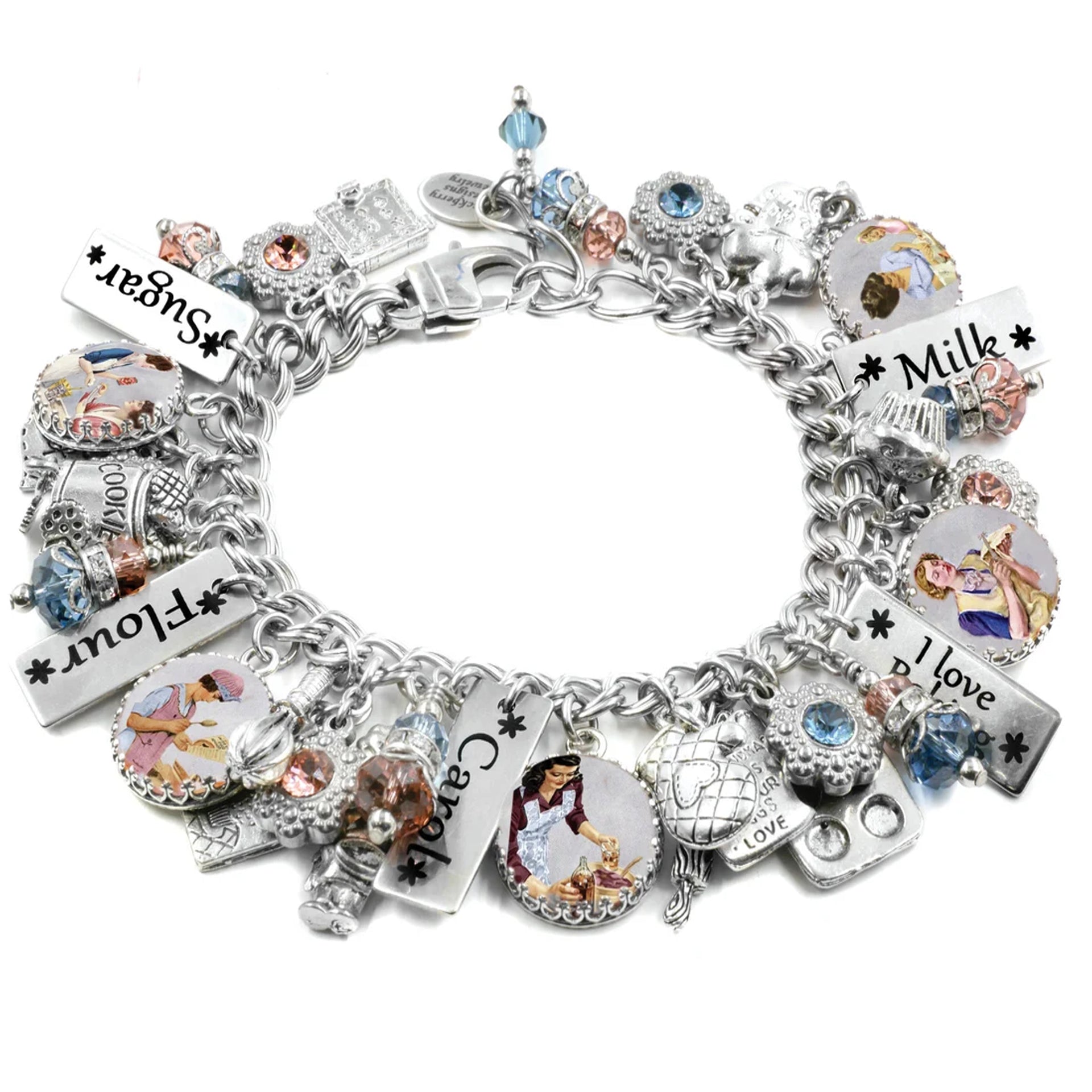 A silver charm bracelet adorned with various charms, including a heart-shaped charm, a star-shaped charm, and a charm featuring a woman. The bracelet also includes charms with the words "Milk" and "I love" written on them.